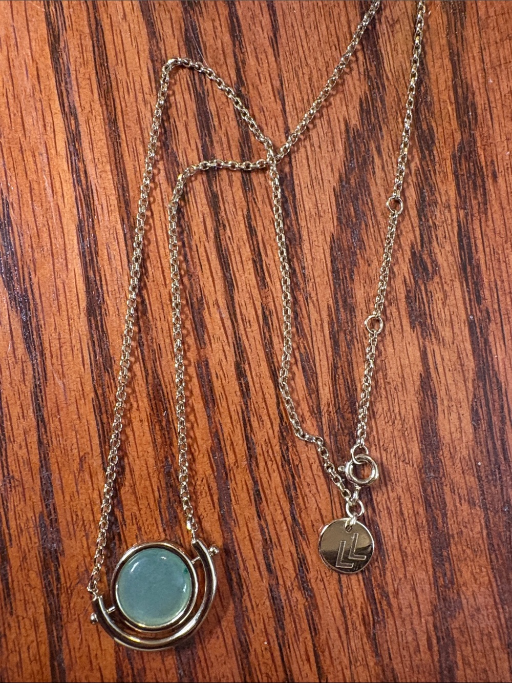 Larissa Loden Sun and Moon Gold Necklace with Jade Green Stone.